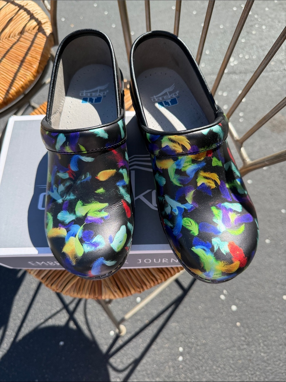 Dansko Black Clogs with Multicolor Floral Brushstroke Print